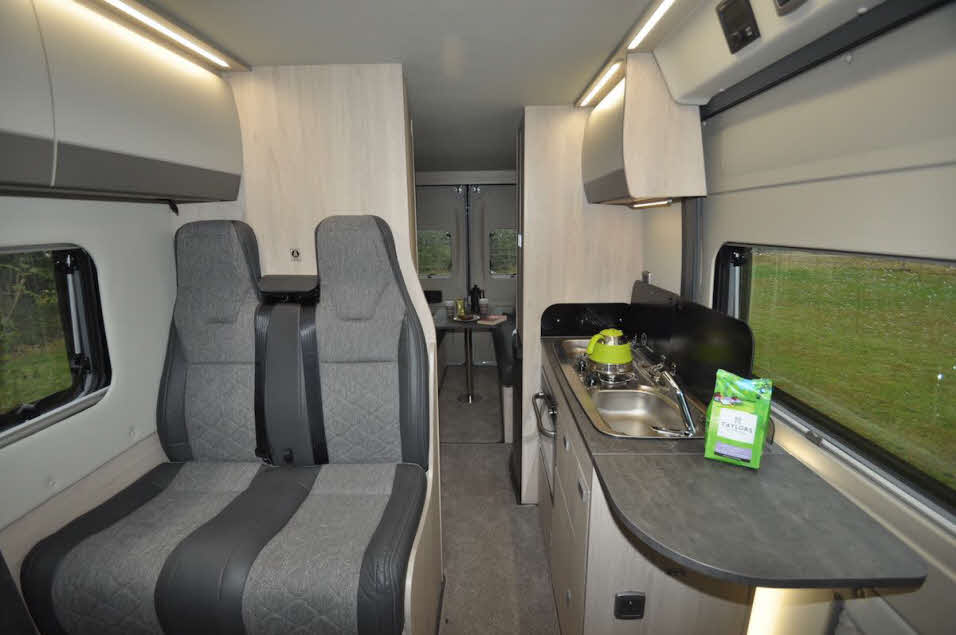 Back to front view of Auto-Trail Adventure 65 LB campervan with seating, kitchen