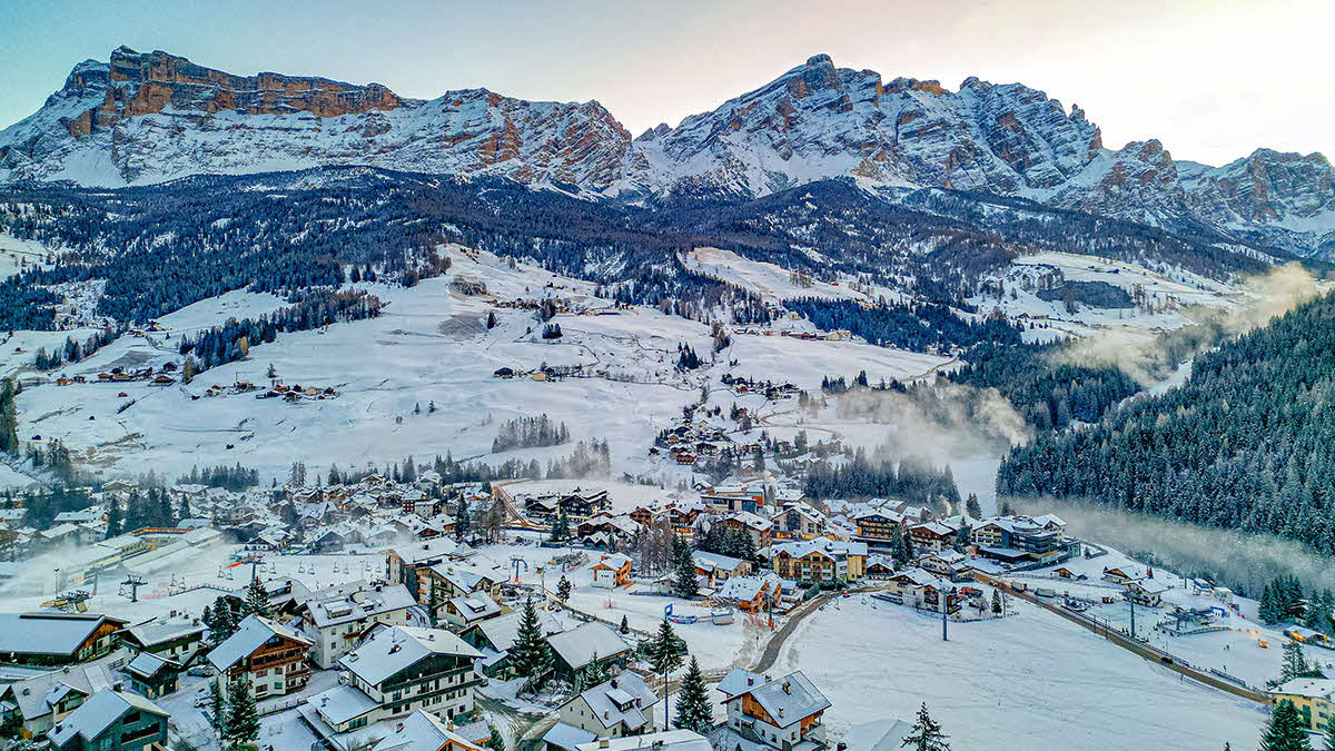 View of a village covered in snow in the Dolomites.