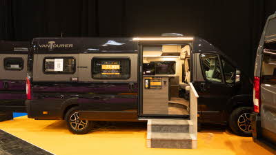 The VANTourer 630 L is black with gold details.  There are two steps up to the open sliding door. 