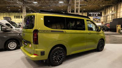 The Hillside Leisure Birchover Classic is in Warm Green, its rising roof and doors are closed.