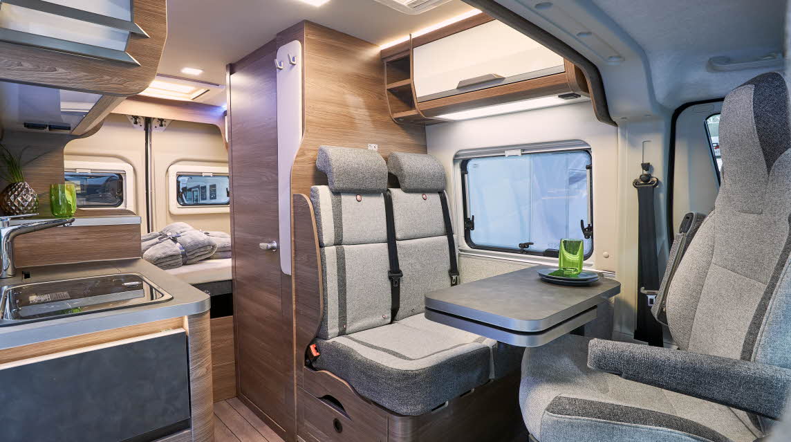Biege upholstery, kitchen sink, rear bed, skylight