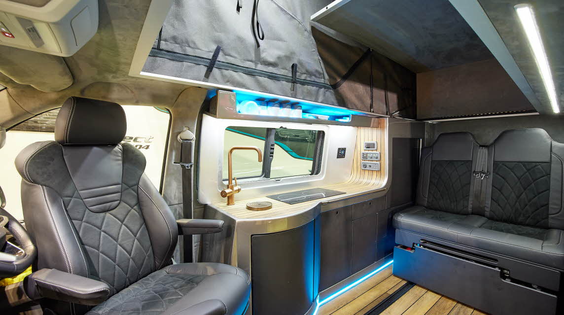 Black upholstery, raise roof, blue accent lighting, wooden floor