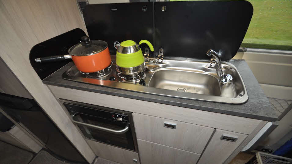 camper-style two ring hob and sink, with fitted grill/warming oven