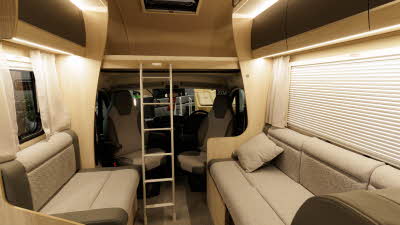 The Auto-Trail Expedition C72 has brown upholstery.  It has a silver ladder for access to the roof bed.