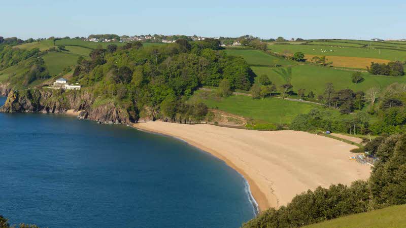 The golden sand on Blackpool Sands Beach near Dartmouth in Devon from above.