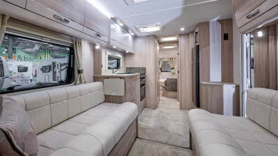 Elddis Avante 860's interior has pale wood furniture and its upholstery is cream.  The bedroom is to the rear and it has a large skylight.