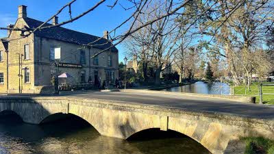 stone bridge over the river at Bourton on the Water in the Cotswolds