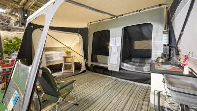 Camp-let North (six berth) interior, kitchen unit, bedroom compartments, stripy groundsheet