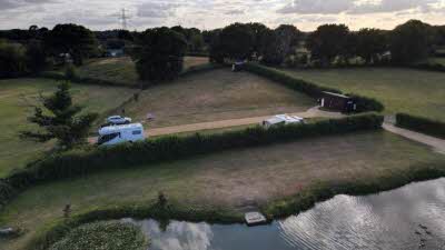 Clump Hill Farm, BH21 7JT, Wimborne Minster, Dorset, CL owner, 2020, aerial view, pitch, grass, caravan, car, trees, grass, pond