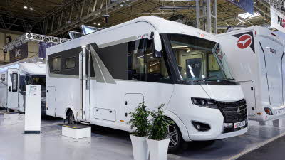 Frankia F-Line I 680 PLUS, the A class is white and its habitation door is open showing into the interior, with a step to gain easy access.  