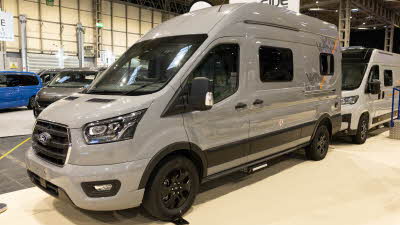 The WildAx Motorhomes Meteor is silver with black and orange decals.