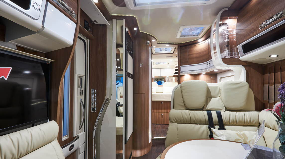 Interior, cream sofas, wooden cabinets, skylight