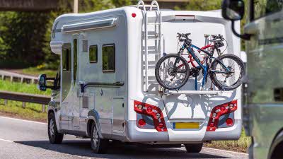 Motorhome driving with bikes attached to the back