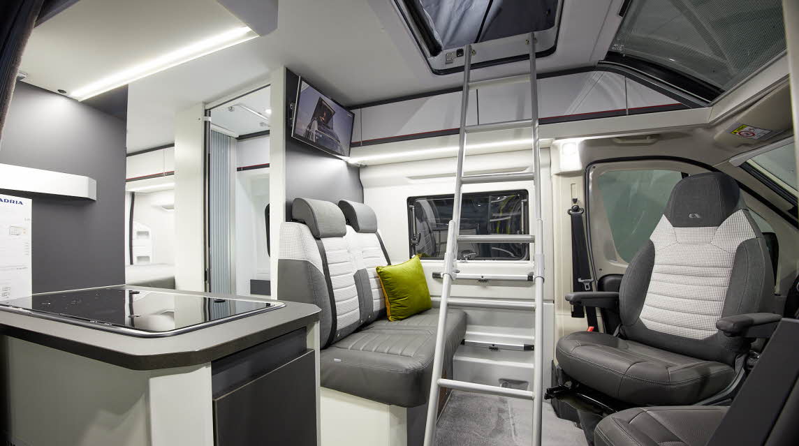 Grey white interior, silver ladder, pop top roof