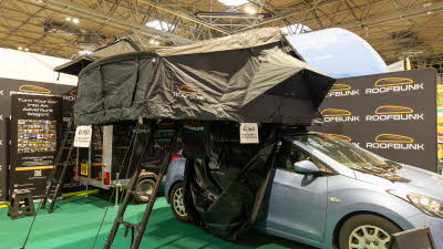 The RoofBunk Explorer has green canvas, it has a green ladder in order to gain easy access.