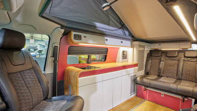 Tan interior, red highlighted furniture, raised roof