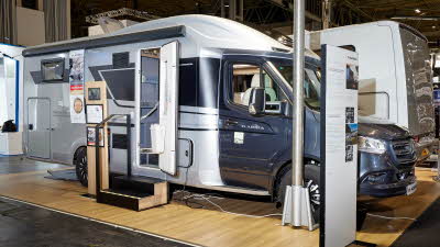 Adria Matrix Supreme MB 670 SL exterior, the motorhome is white with a grey cab, the habitation door is open showing into the interior, with a double step to gain easy access.  The roof light is fully open.