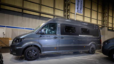 The Rolling Homes Camper Ltd Darwin FL has a dark grey exterior with black trim.