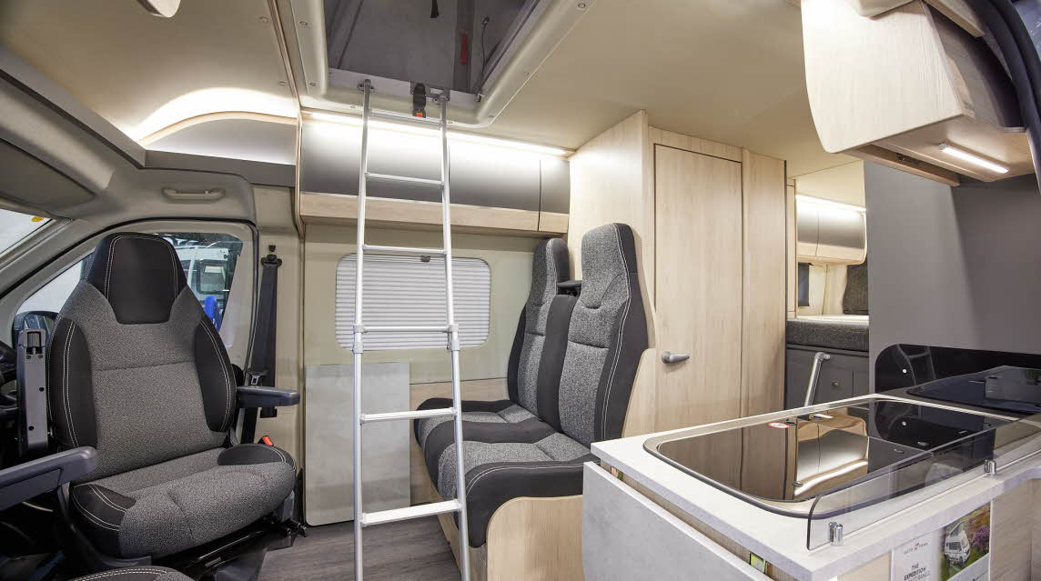 Van Conversion interior, dark/light grey upholstery, ladder to roof bed