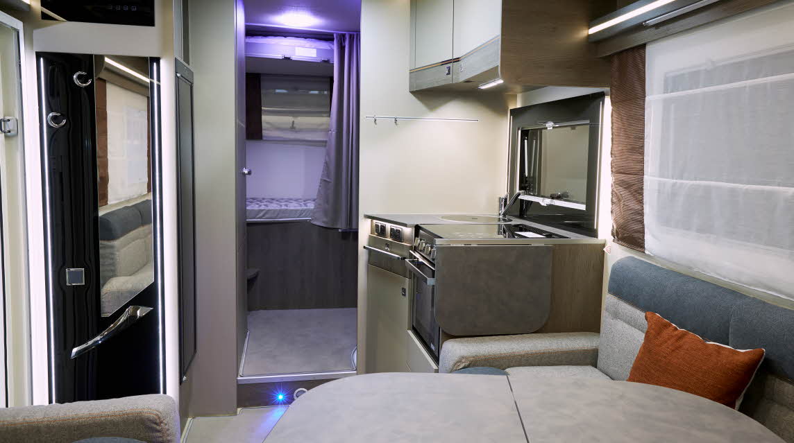 Interior, grey upholstery, purple mood lighting in bedroom