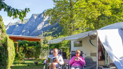 A La Rencontre du Soleil, M19, Rhone-Alpes, France, Overseas, 2021, caravan, couple, mountain, trees, awning