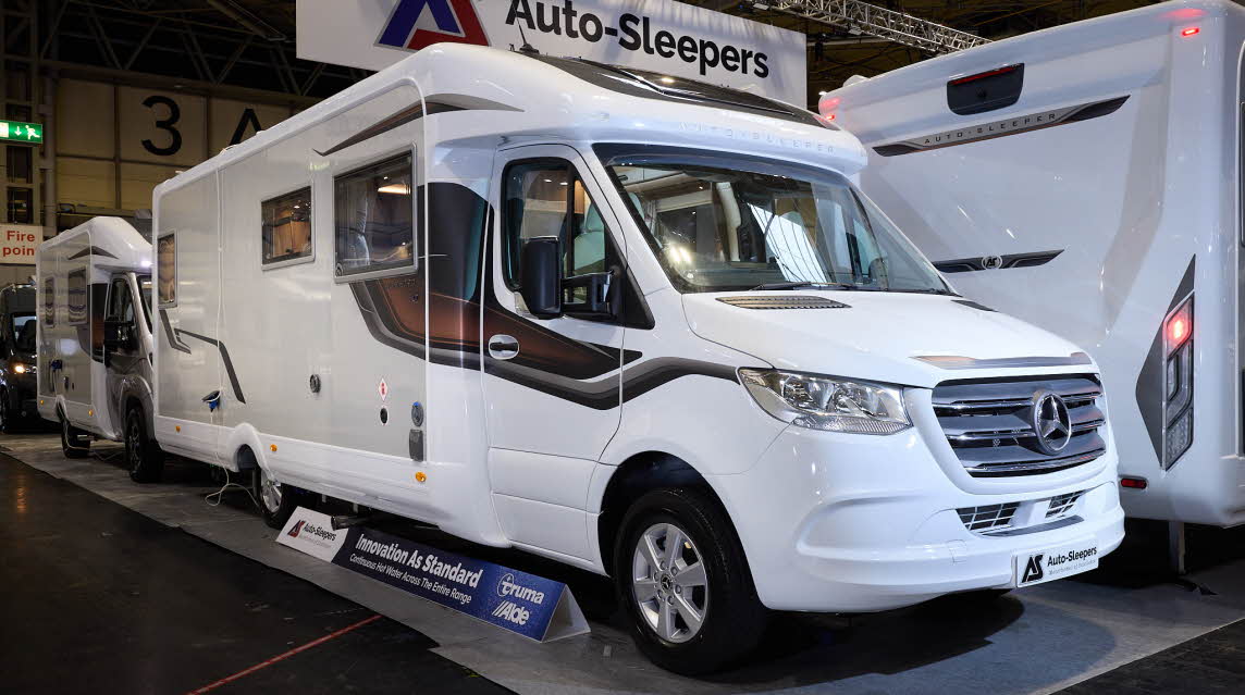 The Auto-Sleeper Burford has a white exterior with a cream inset and bronze/brown decals.