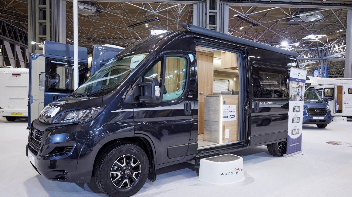 Auto-Trail V-Line 610 Sport exterior, the vehicle is back, the sliding door is open showing into the interior, with a step to gain easy access.