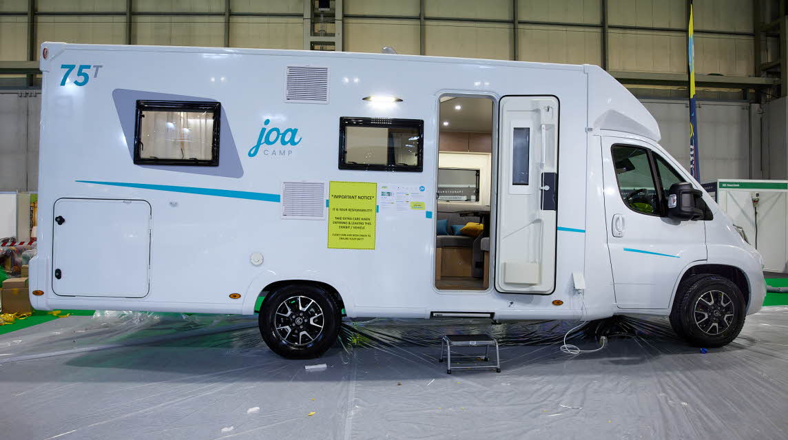 Coachbuilt, white, turquoise graphics