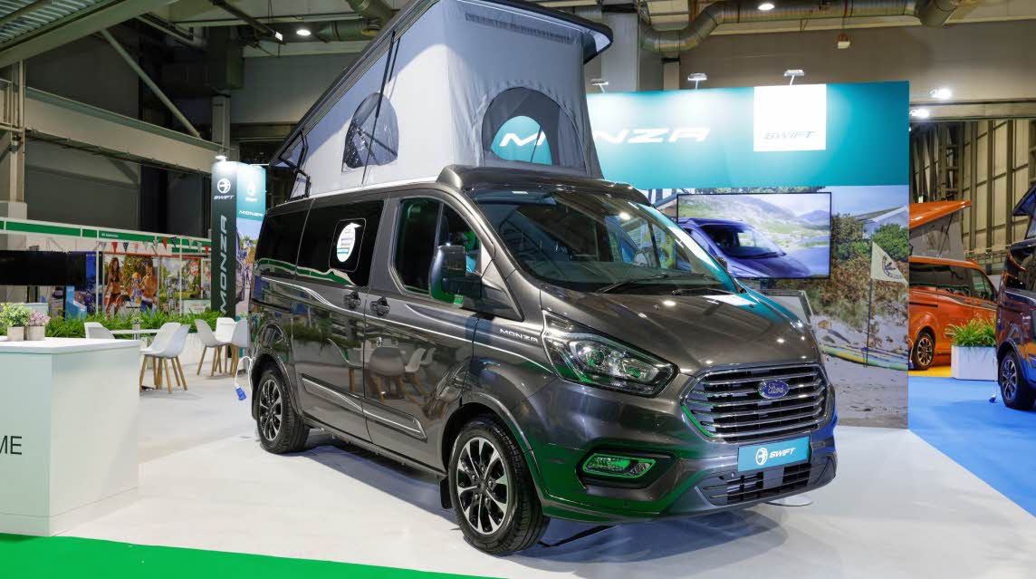 Swift Monza has a grey cab exterior. The rising roof is fully risen. 