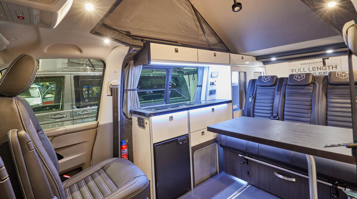 Volksleisure White Star has black upholstery; the panelling is cream.  The rear passenger seat unit can be easily move forwards and backwards due to the sliding rail.