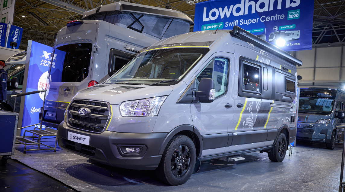 The Swift Trekker XL is grey with black trim with yellow, grey and black decals.  The habitation step is extended.  