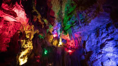 Rainbow coloured lights revealing the amazing shapes in the Meramec Caverns