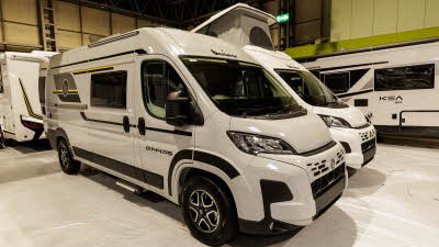 The Benimar Benivan 144 is white with black and yellow decals.