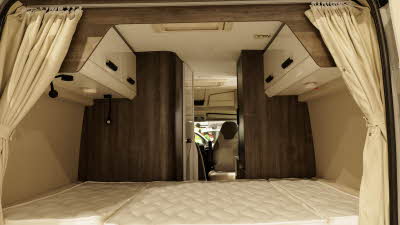 The Benimar Benivan 144 has a rear fixed bed.  Ther are white glossy overhead lockers and there are cream curtains for use when the rear doors are closed.