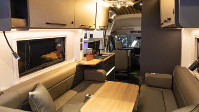 The Bailey Endurance E62 has upholstery in three different shades of brown, the cabinets match.  The ceiling has wooden planks in the same shade as the table.