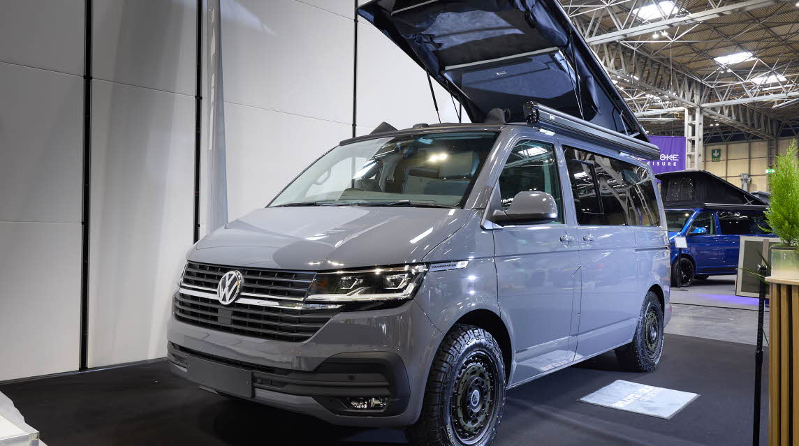 Wildtracks Campervans Explorer is grey and its rising roof is fully extended.
