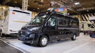The Eura Mobil Van 635 is black.  Its roof light is open.