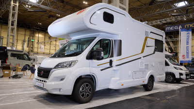 The Eura Mobil Activa One 650 HS has a white body with black and gold decals. There is a window in the over cab area and another at the rear.